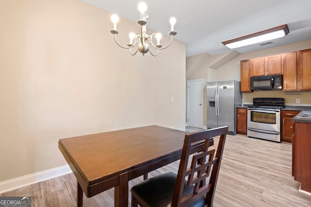 111 Moonlight Trl, Port Wentworth, GA 31407 - dining area featuring a chandelier, light wood finished floors, and baseboards