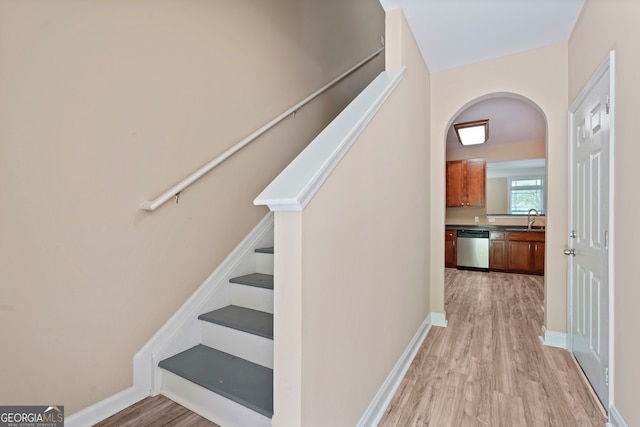 111 Moonlight Trl, Port Wentworth, GA 31407 - stairway featuring wood finished floors, arched walkways, and baseboards