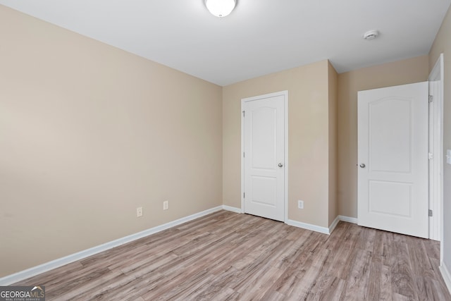 111 Moonlight Trl, Port Wentworth, GA 31407 - unfurnished bedroom featuring light wood finished floors and baseboards