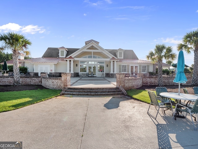 111 Moonlight Trl, Port Wentworth, GA 31407 - rear view of house with french doors and metal roof