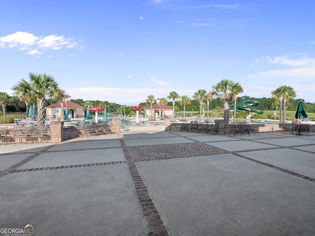 111 Moonlight Trl, Port Wentworth, GA 31407 - surrounding community with a swimming pool and a patio area