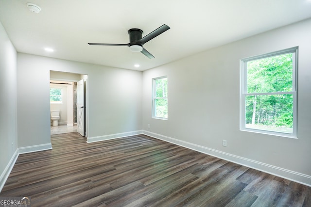 2265 Mobley Bridge Rd, Hogansville, GA 30230 - empty room featuring ceiling fan, dark wood-type flooring, healthy amount of natural light, a smoke detector, and recessed lighting