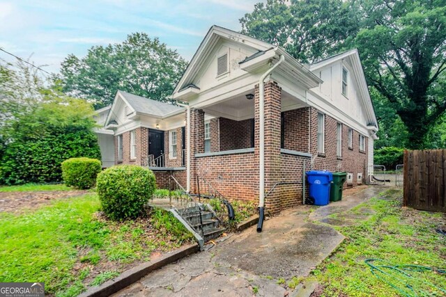 1615 Stokes Ave SW, Atlanta, GA 30310 - view of front facade with brick siding and a porch