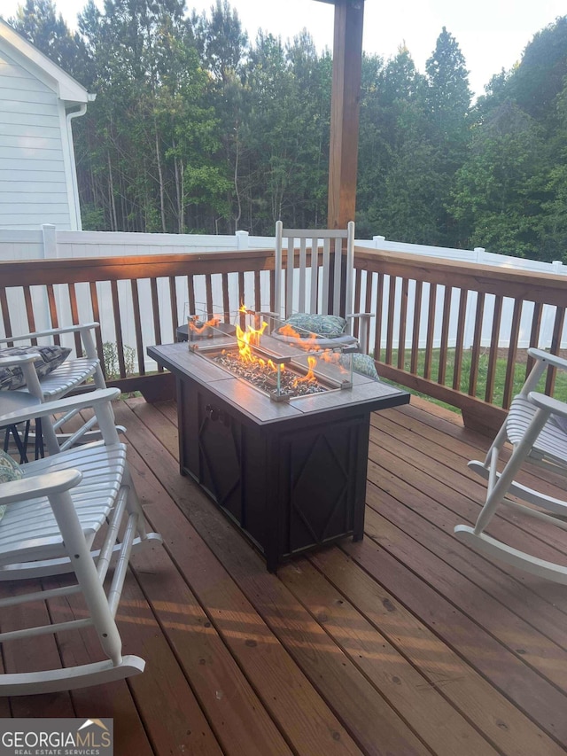 473 Oconner Blvd, Athens, GA 30607 - wooden deck with an outdoor fire pit and a wooded view