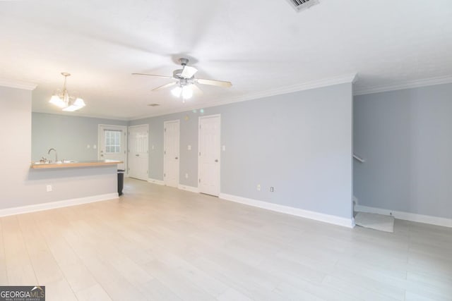 105 Westchester Dr Unit C4, Athens, GA 30606 - unfurnished living room with ceiling fan, ornamental molding, baseboards, a sink, and stairs