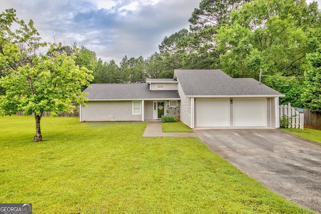 10 1st Ave E, Newnan, GA 30265 - mid-century home featuring a garage, driveway, a shingled roof, and view of scattered trees