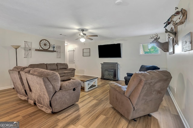 10 1st Ave E, Newnan, GA 30265 - living area featuring a ceiling fan, light wood-style flooring, and baseboards
