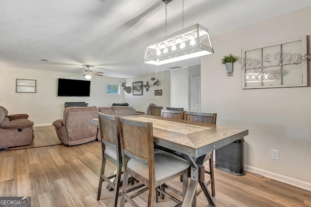 10 1st Ave E, Newnan, GA 30265 - dining room with light wood-style flooring, baseboards, and ceiling fan