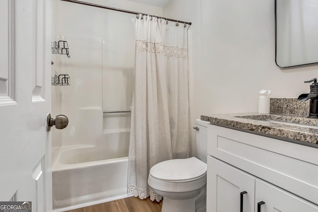 10 1st Ave E, Newnan, GA 30265 - full bathroom featuring toilet, vanity, shower / tub combo with curtain, and wood finished floors
