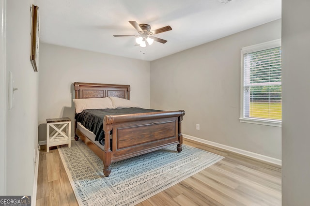 10 1st Ave E, Newnan, GA 30265 - bedroom with wood finished floors, baseboards, and a ceiling fan