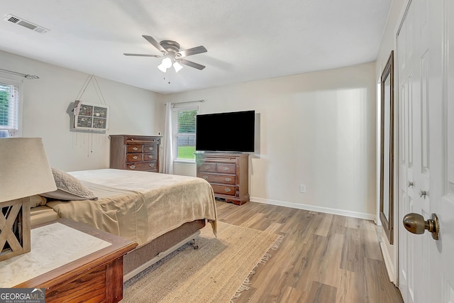 10 1st Ave E, Newnan, GA 30265 - bedroom featuring light wood finished floors, baseboards, and a ceiling fan