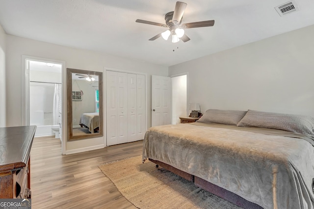 10 1st Ave E, Newnan, GA 30265 - bedroom featuring light wood finished floors, a closet, ensuite bath, and ceiling fan
