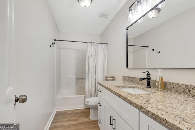 10 1st Ave E, Newnan, GA 30265 - full bath with toilet, vanity, shower / bathtub combination with curtain, wood finished floors, and baseboards