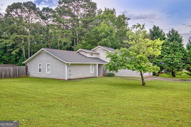 10 1st Ave E, Newnan, GA 30265 - view of property exterior with a garage, driveway, and a shingled roof