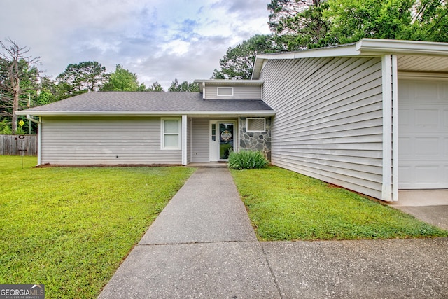 10 1st Ave E, Newnan, GA 30265 - mid-century inspired home with a front lawn, an attached garage, and a shingled roof