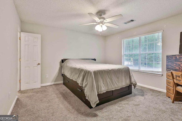 40 Moore Rd, Newnan, GA 30263 - bedroom featuring a textured ceiling, carpet floors, baseboards, and ceiling fan
