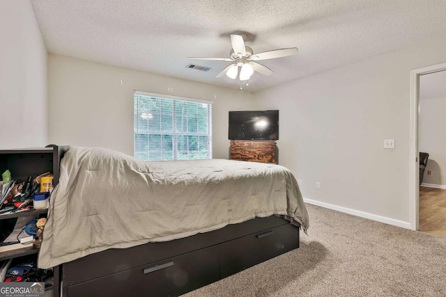 40 Moore Rd, Newnan, GA 30263 - bedroom featuring a textured ceiling, ceiling fan, baseboards, and carpet flooring