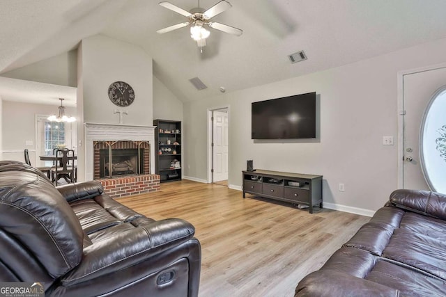 40 Moore Rd, Newnan, GA 30263 - living room featuring a ceiling fan, a chandelier, wood finished floors, lofted ceiling, and baseboards