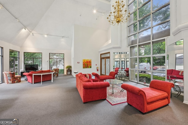 209 14th St NE Unit 109, Atlanta, GA 30309 - carpeted living area featuring track lighting, high vaulted ceiling, and a chandelier