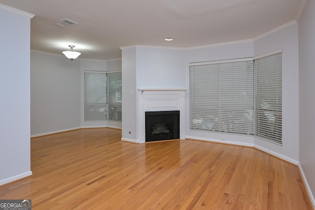 209 14th St NE Unit 109, Atlanta, GA 30309 - unfurnished living room with a fireplace, light wood finished floors, ornamental molding, and recessed lighting