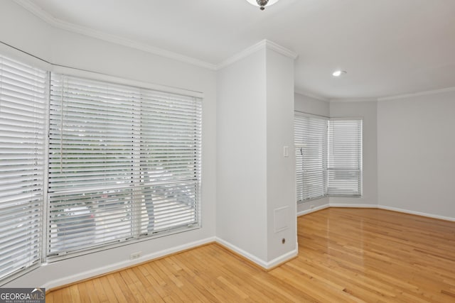 209 14th St NE Unit 109, Atlanta, GA 30309 - unfurnished room with wood finished floors, crown molding, and recessed lighting