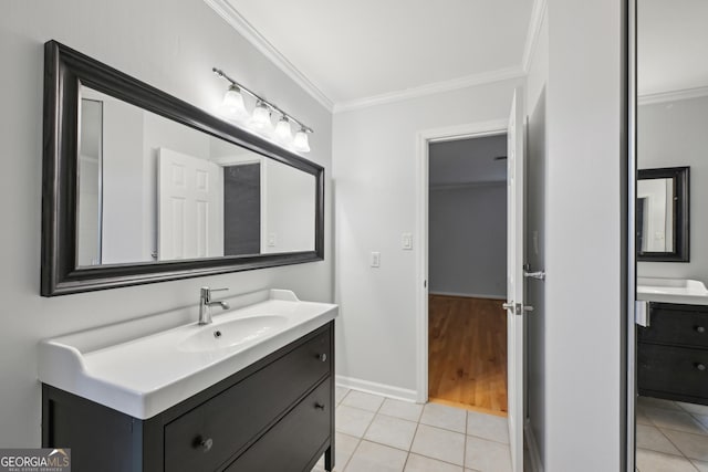 209 14th St NE Unit 109, Atlanta, GA 30309 - bathroom with vanity, ornamental molding, and tile patterned floors