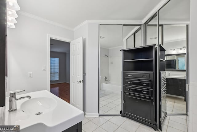 209 14th St NE Unit 109, Atlanta, GA 30309 - full bath featuring vanity, tile patterned flooring, crown molding, and bathtub / shower combination