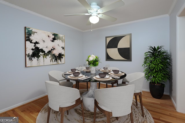 209 14th St NE Unit 109, Atlanta, GA 30309 - dining space with a ceiling fan, ornamental molding, and light wood-type flooring