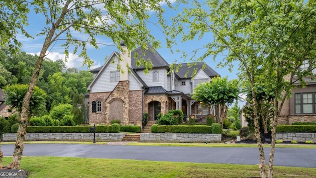 4224 Dogwood Bend Park, Berkeley Lake, GA 30096 - english style home featuring a front lawn, a standing seam roof, brick siding, and a chimney