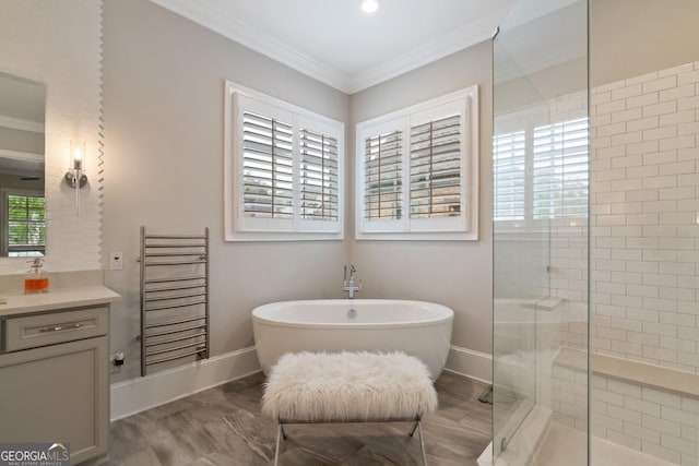 4224 Dogwood Bend Park, Berkeley Lake, GA 30096 - full bath with radiator, a freestanding bath, vanity, crown molding, and baseboards