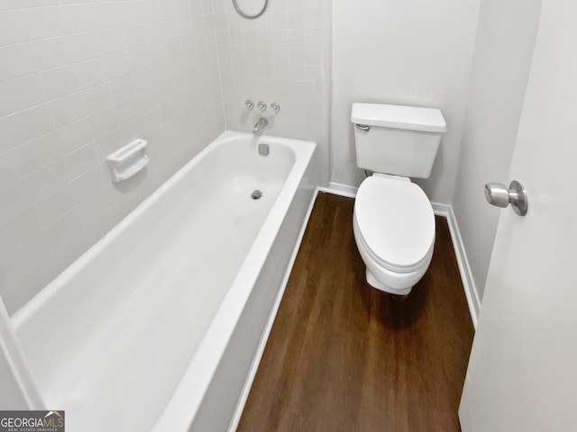 688 Anderson Walk, Marietta, GA 30062 - bathroom with wood finished floors, baseboards, toilet, and washtub / shower combination