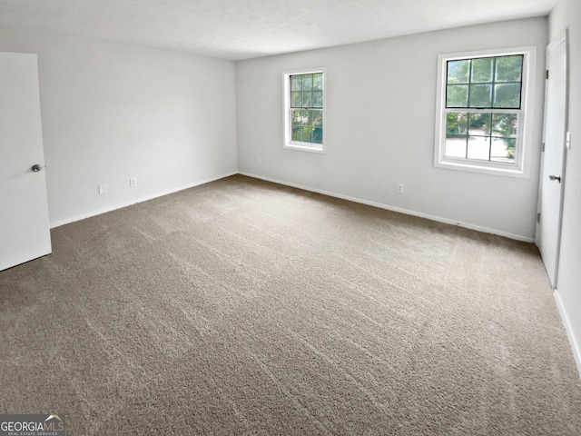 688 Anderson Walk, Marietta, GA 30062 - carpeted spare room featuring baseboards