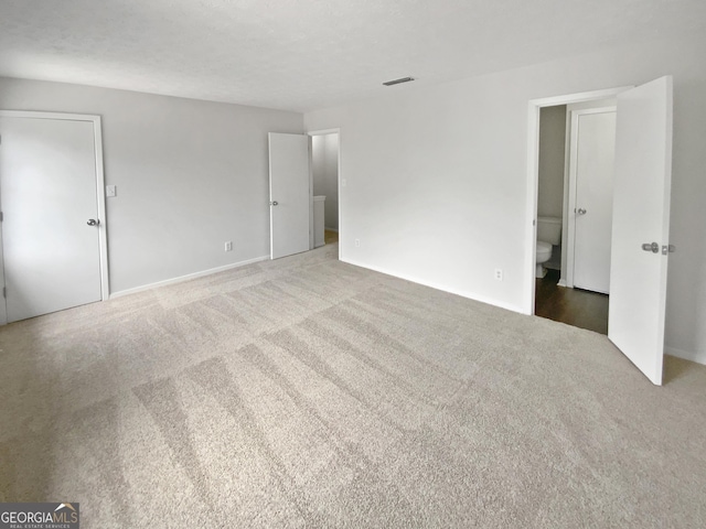 688 Anderson Walk, Marietta, GA 30062 - unfurnished bedroom with carpet and baseboards
