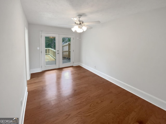 688 Anderson Walk, Marietta, GA 30062 - spare room with french doors, baseboards, a ceiling fan, and wood finished floors
