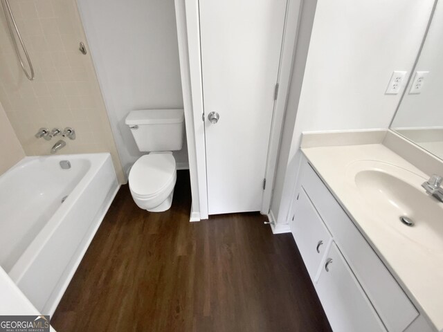 688 Anderson Walk, Marietta, GA 30062 - bathroom with wood finished floors, vanity, toilet, shower / bath combination, and baseboards