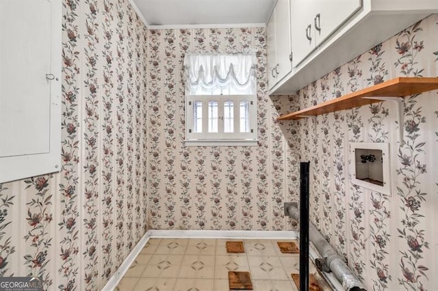 8140 Wood St SE, Covington, GA 30014 - washroom with cabinet space, baseboards, wallpapered walls, washer hookup, and ornamental molding