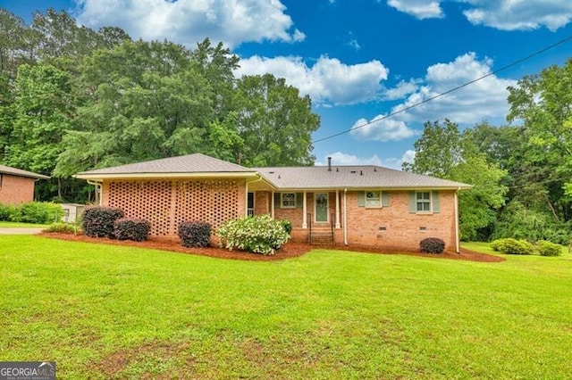 8140 Wood St SE, Covington, GA 30014 - back of property with a yard and brick siding