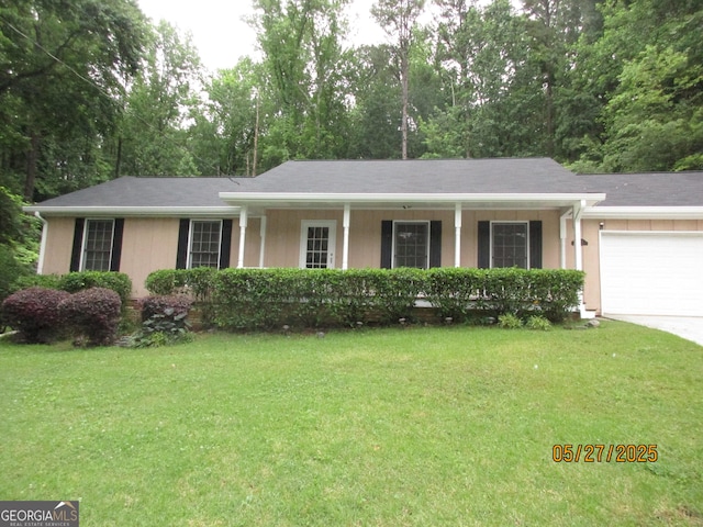 5848 Navarre Ct, Stone Mountain, GA 30087 - single story home featuring a front lawn, a garage, driveway, a porch, and view of wooded area
