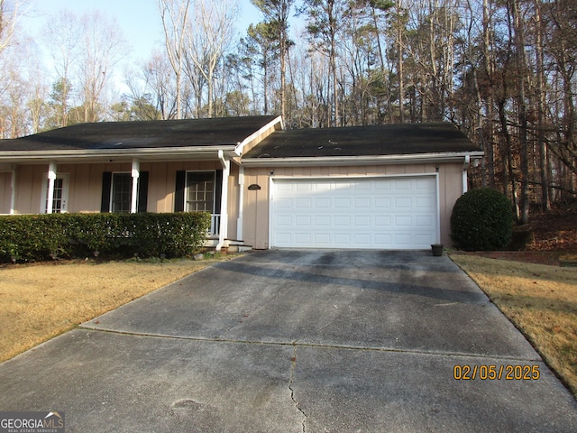 5848 Navarre Ct, Stone Mountain, GA 30087 - ranch-style home with a garage, driveway, a front yard, and board and batten siding
