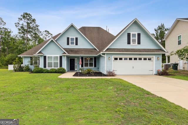 330 Daniel Trent Way, Kingsland, GA 31548 - traditional home featuring driveway, roof with shingles, a front lawn, and an attached garage
