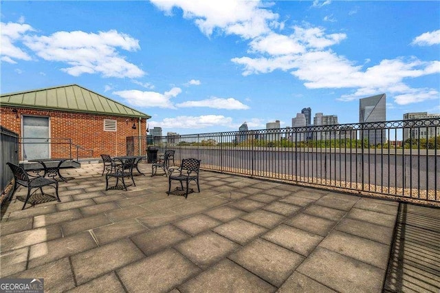 3235 Roswell Rd NE Unit 508, Atlanta, GA 30305 - view of patio / terrace featuring outdoor dining area