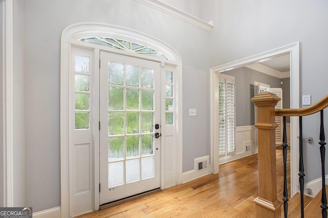 386 Link Rd, Alpharetta, GA 30022 - entrance foyer featuring light wood-style flooring, a wainscoted wall, and ornamental molding
