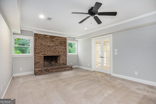 386 Link Rd, Alpharetta, GA 30022 - unfurnished living room featuring french doors, crown molding, a fireplace, carpet flooring, and baseboards
