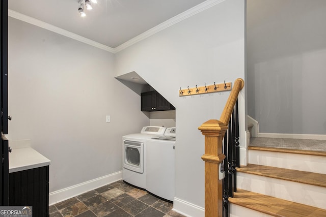 386 Link Rd, Alpharetta, GA 30022 - washroom featuring washing machine and clothes dryer, cabinet space, baseboards, ornamental molding, and dark stone finish flooring