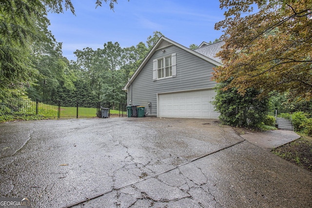 386 Link Rd, Alpharetta, GA 30022 - view of side of property with driveway and an attached garage