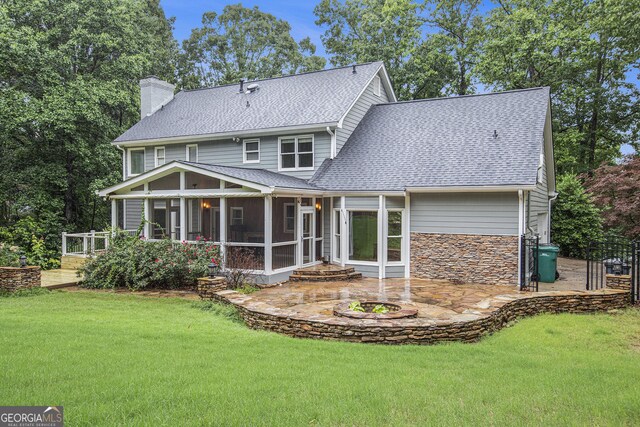 386 Link Rd, Alpharetta, GA 30022 - rear view of house with a sunroom, a shingled roof, a chimney, a patio area, and a lawn