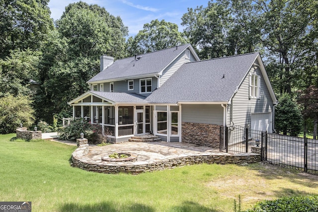 386 Link Rd, Alpharetta, GA 30022 - rear view of property featuring a sunroom, an attached garage, roof with shingles, a patio area, and a chimney