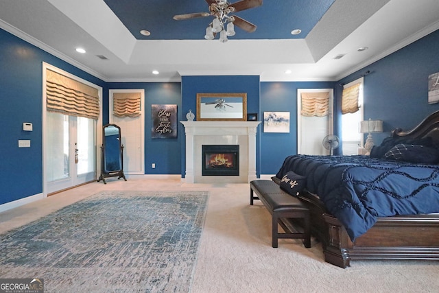 12 Par Dr, Jesup, GA 31546 - bedroom with carpet flooring, ornamental molding, recessed lighting, a warm lit fireplace, and a raised ceiling