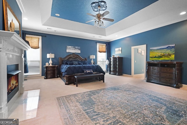 12 Par Dr, Jesup, GA 31546 - bedroom featuring multiple windows, a premium fireplace, carpet floors, a tray ceiling, and recessed lighting
