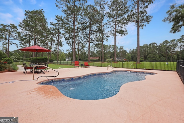 12 Par Dr, Jesup, GA 31546 - view of swimming pool featuring a patio and view of scattered trees